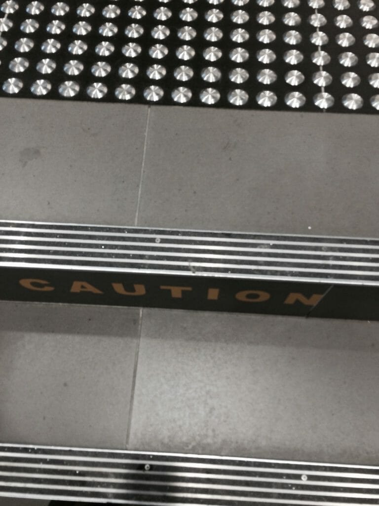 Aluminium stair nosing with multiple black carborundum inserts