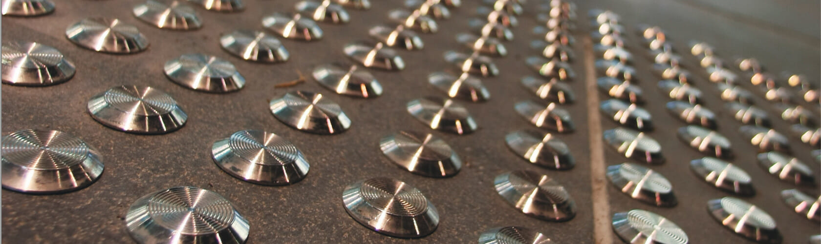 Image of a SureSteel - Stainless Steel Tactile Indicators available from www.gripACTion.com.au